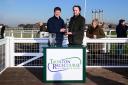 Neil Mulholland (left) the trainer of Dead Right won the big race at Taunton Racecourse and is presented with the Arthur and Peggy White Memorial Trophy by his grandson. Pic: PPAUK.