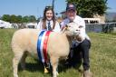 Robert and Sophie Hole show off their Dorset Horn  Poll Dorset shearling ewe Eucalyptus winner of the sheep interbreed championship