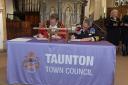 Taunton Mayor Councillor Nick O’Donnell and Rear Admiral, Ian Moncrieff CBE DL, signing the document