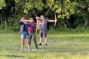 Explorers having a go at archery. Picture: Nigel Taylor