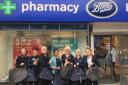Staff from Boots in Taunton giving bags to Rosie Hather from Arc.