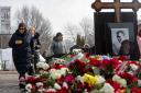 Russian opposition leader Alexei Navalny’s mother, Lyudmila Navalnaya laid flowers at his grave (AP)