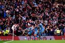 Arsenal suffered a setback in the Premier League title race with a 2-0 loss at home to Aston Villa (Adam Davy/PA)