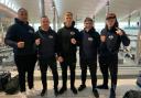 DEPARTURE: Taunton boxer Pawel August (pictured centre) and his team heading to Poland