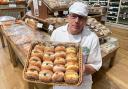 Bob Boulton, bakery manager at Rumwell Farm Shop, holds a basket of freshly-baked doughnuts. Picture: Rumwell Farm Shop