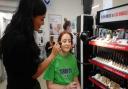 A happy customer getting a makeover at a previous Boots gala event