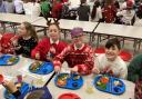 Children enjoy a Christmas lunch at St John's C of E Primary School in Wellington.