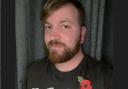 Former Somerset Royal Marine Rob French with the new plastic-free poppy. Picture: Royal British Legion