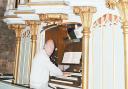Choir member David Yates plays Holy Trinity’s church organ in 2010