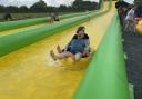 Liberal Democrat leader Ed Davey in a rubber ring on a waterslide with Anna Sabine, the Lib Dem candidate in Frome and East Somerset.