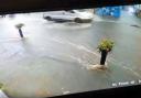 Flash flooding in Glastonbury saw street signage and chairs carried down the road in the rainwater.
