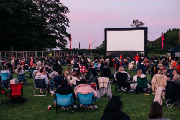 Somerset County Gazette: People at an outdoor cinema event. Credit: Adventure Cinema