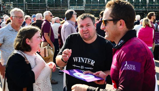 Somerset County Gazette: Somerset County Cricket Club's One-Day Cup celebration. Roelof van der Merwe signs autograph. Pic: Steve Richardson.