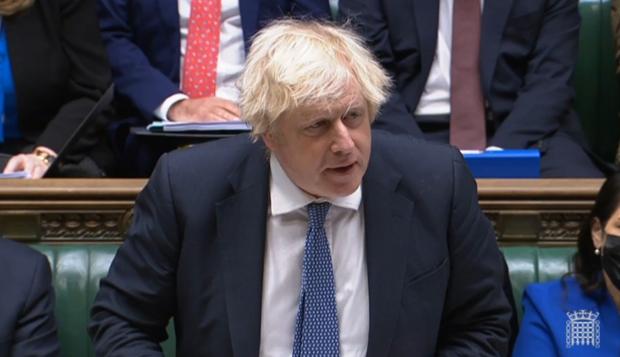 Somerset County Gazette: QUIZZED: Boris Johnson today praised "the heroes of the vaccine rollout" but was faced with questions about a reported Downing Street party while London was in tier three last year (Image: House of Commons, PA Wire)