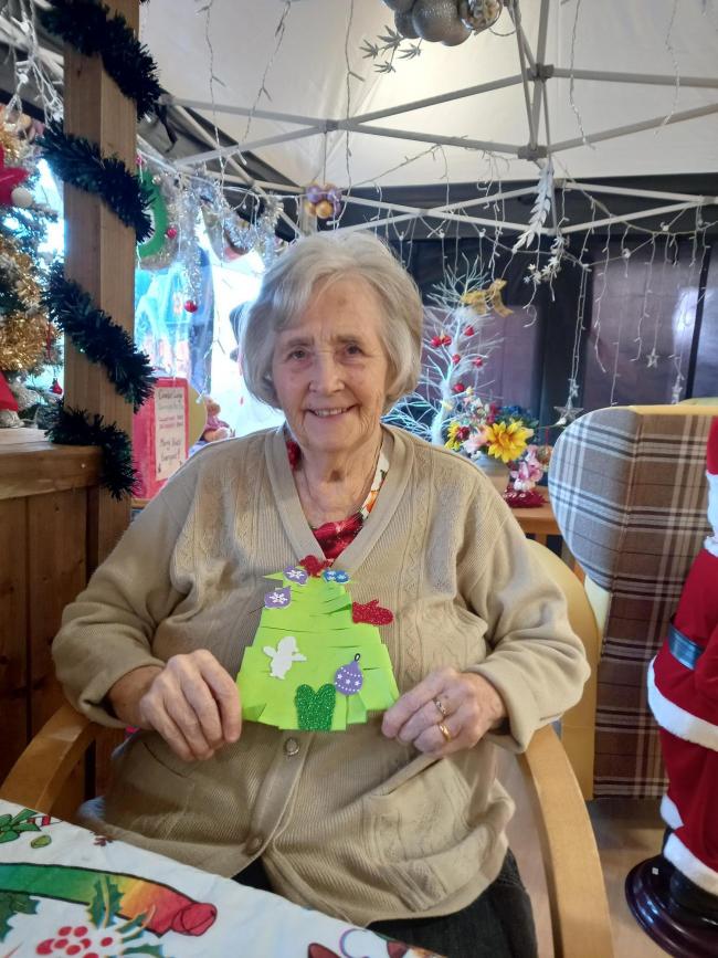 FEELING FESTIVE: Care home resident Barbara Doubtfire with her Christmas decorations