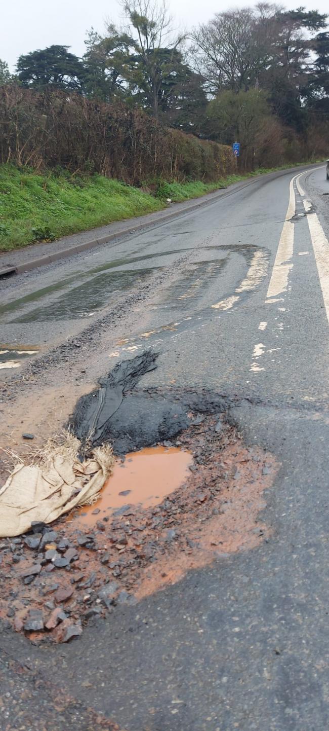 DAMAGE: The pothole on the A38 has now been fixed