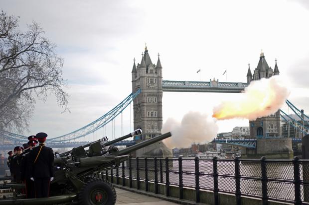 Somerset County Gazette: Members of the Honourable Artillery Company fire a gun salute from the wharf at the Tower of London to mark the official start of the Platinum Jubilee. Picture: PA