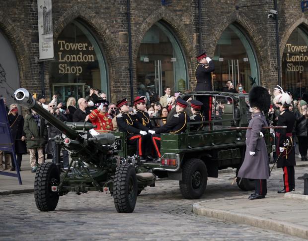 Somerset County Gazette: Members of the Honourable Artillery Company fire a gun salute from the wharf at the Tower of London to mark the official start of the Platinum Jubilee. Picture: PA