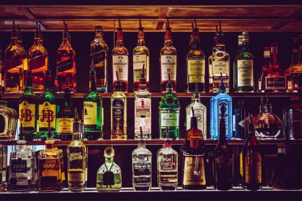 Somerset County Gazette: Shelves of alcoholic spirits to make cocktails. Credit: Canva