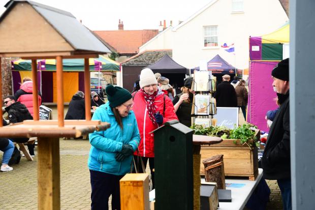 Somerset County Gazette: Shoppers take a look at the goods on offer at Watchet street fair.