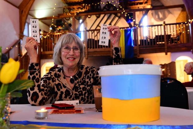 Somerset County Gazette: Jane Askey with her raffle tickets next to a collection bucket for the Ukrainian Red Cross.