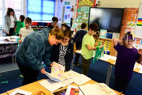Somerset County Gazette: Parents Squirrel Class pupils look at work produced for the Circle of Life project. Somerset County Gazette: Parents Squirrel Class pupils look at work produced for the Circle of Life project.