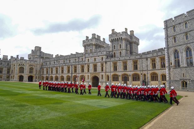 Somerset County Gazette: The Earl of Wessex presents new colours to the Royal Gibraltar Regiment during a ceremony at Windsor Castle. Picture: PA