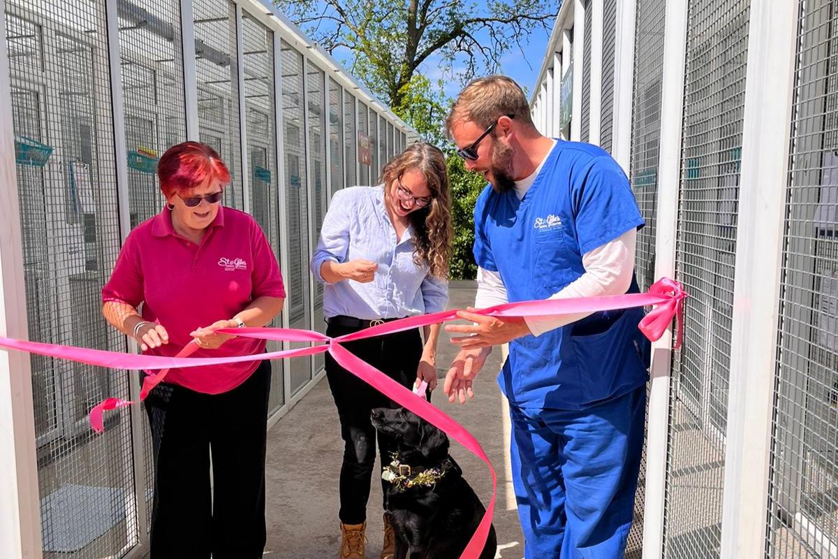 Florist Grace Haskins opens the new cattery with Jan Brooks, Jack Linnell, and her dog Luna. Picture: St Giles Animal Rescue
