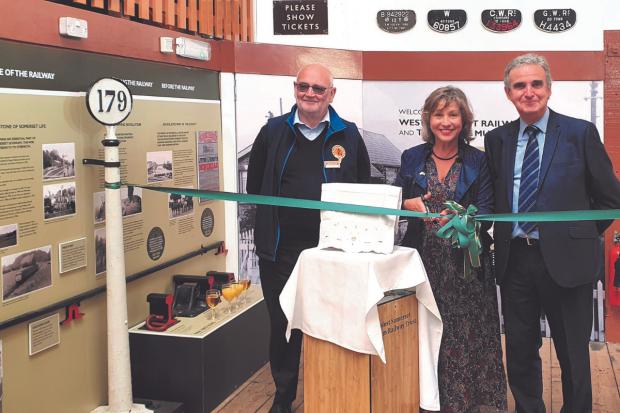Rebecca Pow MP cuts the ribbon to re-open the revamped Gauge Museum at Bishops Lydeard Station with curator Ian Camp (left) and Heritage Trust chairman Mike Thompson. Picture: Ian Coleby