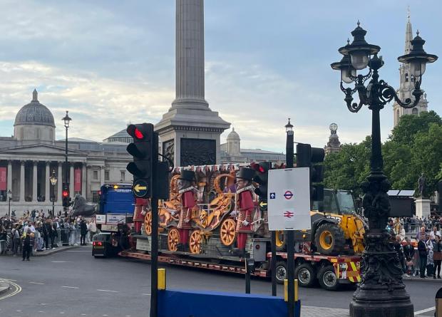 Somerset County Gazette: the cart being given a Police escort through Central London yesterday (June 3) Photo by Andy Bennett