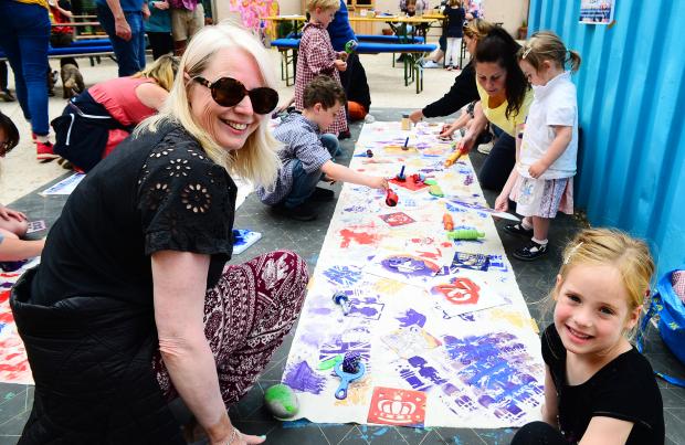 Somerset County Gazette: Angela and Freya U’Dell take part in the Jubilee Canvas painting workshop at East Quay. Picture: Steve Richardson