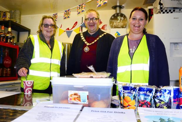 Somerset County Gazette: Katherine MacDonald, Andy Kingston-James (Minehead mayor) and Lisa Paisley help with the refreshments.