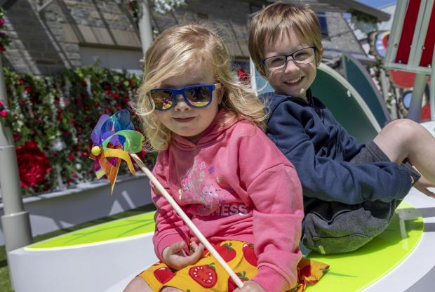 Somerset County Gazette: Children enjoy relaxing in the sunshine in the new space. Picture: Clarks Village