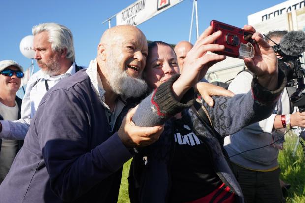 Somerset County Gazette: Michael Eavis poses for a selfie with a festivalgoer at Worthy Farm. Picture: Yui Mok, PA Wire