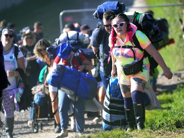 Somerset County Gazette: People arrive on the first day of Glastonbury Festival. Picture: Yui Mok, PA Wire