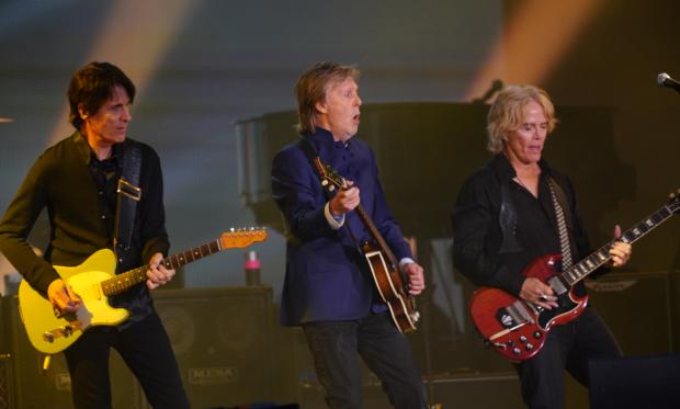 Somerset County Gazette: Paul McCartney on stage with his band (PA Wire/PA Images. Photo by Yui Mok)