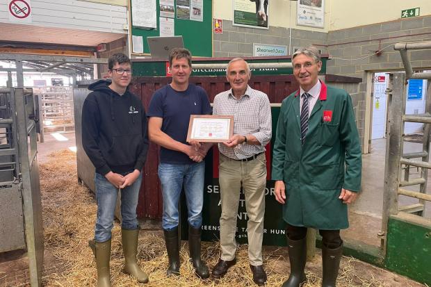 Record breaker – Martin Pratt and his son, Edward, with John Gardener, who bought the heifer on behalf of a client, with auctioneer, Derek Biss