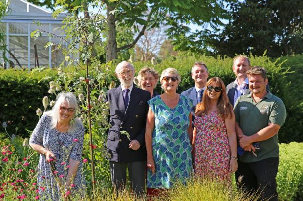 Guest speaker Caroline Woolley (far left) plants a tree to mark 100 years of land-based studies in Cannington. Picture: Bridgwater and Taunton College