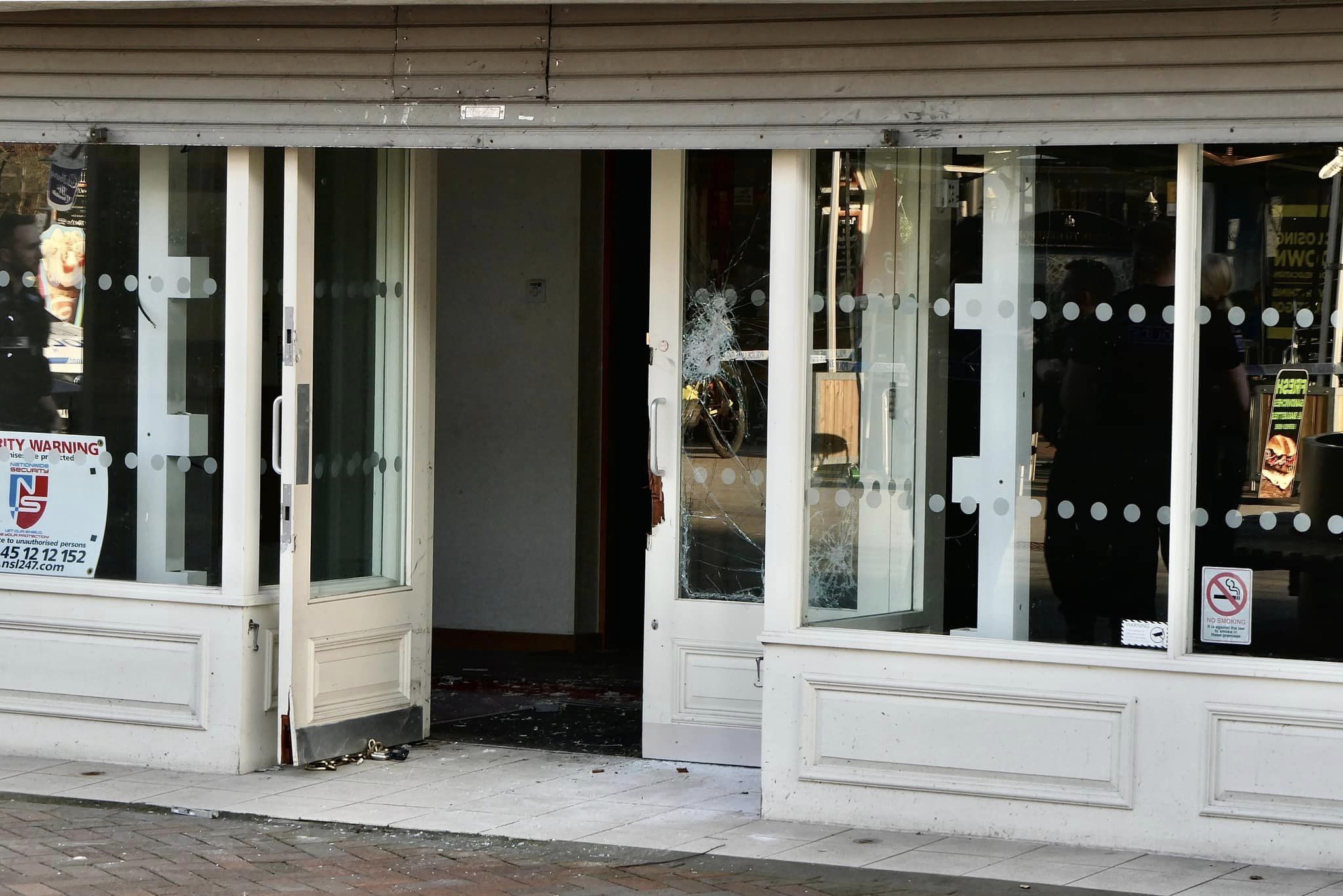 A door at the former H Samuel shop in Hereford was smashed by police. Picture: Ian Jebb