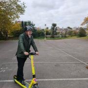 Cllr Peter Partington trying out one of the e-scooters