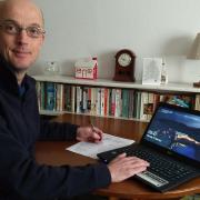 Tim Finch, director of ScholTech with one of the laptops. Pictures: Contributed