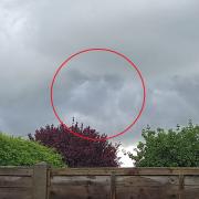 FACE IN THE CLOUDS: Can you pick out the features of the face in the thunder?