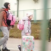 A family crosses the border from Ukraine into Medyka, Poland. Picture: Victoria Jones, PA Wire