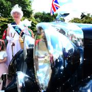 Porlock held its own regal procession on Friday featuring the village's own Queen driven by a chauffeur. Picture: Steve Richardson