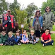 Hindhayes pupils and Clarks Village staff unveil jubilee tree.