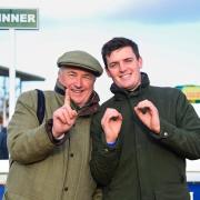 Paul Nicholls left and his assistant Charlie Davies celebrate passing the 100 winners for the season. Picture: PPAUK