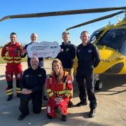 HELP Appeal presents cheque to Dorset and Somerset Air Ambulance.
