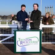 Neil Mulholland (left) the trainer of Dead Right won the big race at Taunton Racecourse and is presented with the Arthur and Peggy White Memorial Trophy by his grandson. Pic: PPAUK.