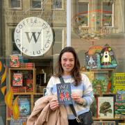 Angharad Walker outside Waterstones Bath with her shortlisted novel for children, Once Upon a Fever, published by Chicken House