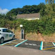 An electric vehicle charging point has been placed in the medieval village of Dunster in Somerset.